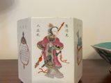 a small white box with a picture of a woman on it