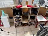a room with a lot of items on the shelves