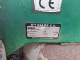 a close up of a green machine with a number plate on it