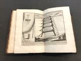 an open book with a drawing of a tower on top of it