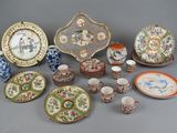 many plates and cups and saucers on the table