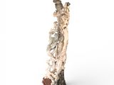 a statue of a man on a surfboard on a white surface