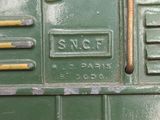 a close up of a green toy truck with a ladder
