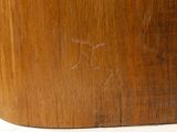 a close up of a wooden box with a small bird on it