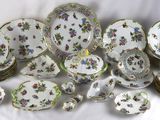 many plates and bowls that are sitting on a table
