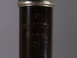 close up of a silver plated wine bottle with a label on it