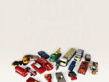 a lot of toy cars that are on a white surface