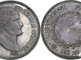 a close up of a coin with a man ' s head on it