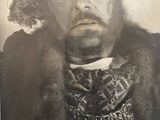 an old photo of a man with a beard and a fur coat
