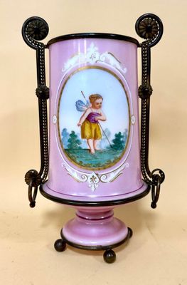 a purple vase with a picture of a little girl on it