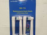 two toothbrush heads in a package with a plastic cover