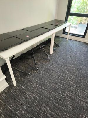 an image of a conference room with a long table and chairs