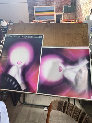 two large posters on a table in a room