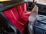 two seats in the back of a car that are red