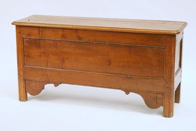 a small wooden chest on a white background