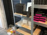 a shelf with many different items on it in a room