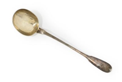 an antique silver spoon with a spoon handle on a white surface
