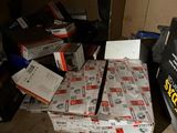 a pile of boxes on a table with a phone in it