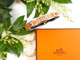 a bracelet that is sitting on top of a box