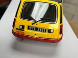 a toy car sitting on top of a white table