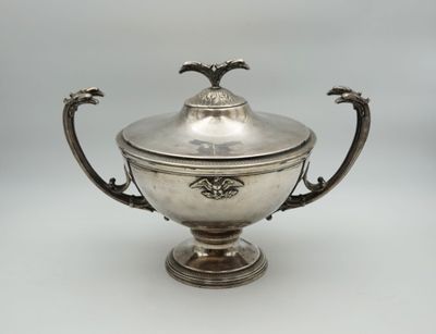 an antique silver plated bowl with a lid and handles