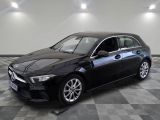 une photo d'une Mercedes CLA noire garée dans un garage