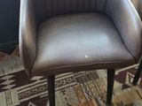 two chairs that are sitting in front of a window
