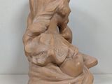 statue of a woman holding a baby in her arms