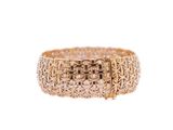 a close up of a gold ring on a white background