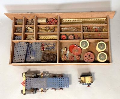 a wooden box filled with different types of sewing supplies