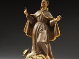 an image of a statue of a man standing on a rock