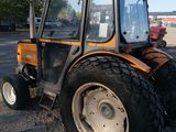 a tractor that is parked in the dirt