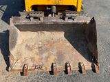 a yellow bulldozer that is parked in the parking lot