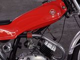 a red motorcycle that is parked in a parking lot