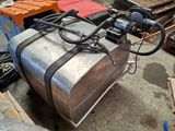 a large metal tank sitting on the floor in a garage