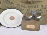 pair of goggles sitting on top of a table next to a plate