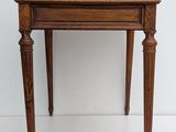 a small wooden table with a telephone on top of it