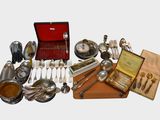 many different types of silverware and silverware on display