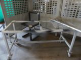 an image of a metal work bench with a cat on it