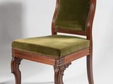 an image of a chair with a green upholstered seat on a white background