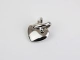 a silver heart charm on a white background
