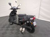 a scooter that is parked in a room
