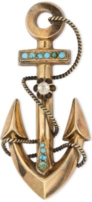 an image of a gold anchor with a cross and turquoise stones
