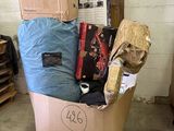 a cart full of boxes and other items in a room