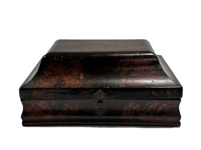 a small wooden box with a floral design on it