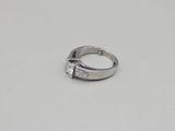an image of a diamond ring on a white surface
