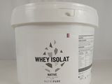 the container of whey is sitting on a white surface