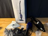 a box of vacuum cleaners on a table next to other items