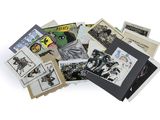 a pile of books with pictures on them on a white surface