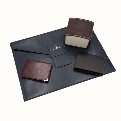 a close up of a wallet and a wallet case on a white background